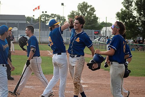 Mike Thiessen / Winnipeg Free Press 
The St. Boniface Legionnaires celebrate following three players crossing home base in one hit in their game against the reigning Manitoba Junior Baseball League champions, the Elmwood Giants. For Joshua Sam-Frey. 230726 &#x2013; Wednesday, July 26, 2023