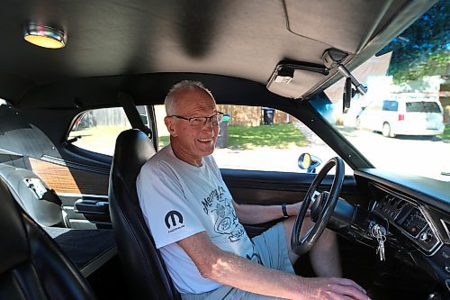 Brandon's Grant Gillis is all smiles at the wheel of his 1976 Dodge Dart Sport two-door coupe on Thursday. (Michele McDougall/The Brandon Sun)
