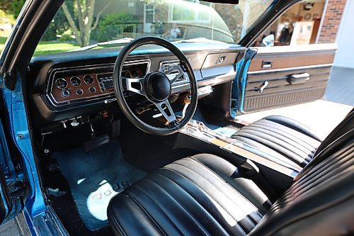 The three-spoke steering wheel and wood-grained instrument panel of Brandon's Grant Gillis's 1976 Dodge Dart Sport two-door coupe in a west-end neighbourhood on Thursday. (Michele McDougall/The Brandon Sun)
