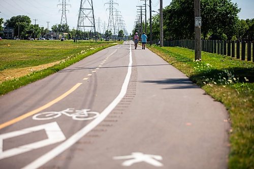 MIKAELA MACKENZIE / WINNIPEG FREE PRESS

Sandra Kolter and Marcel Chartier walk down the new Northwest Hydro Corridor Multi-Use Path on Thursday, July 27, 2023. For &#x460;story.
Winnipeg Free Press 2023