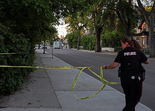JESSICA LEE / WINNIPEG FREE PRESS

A police officer sets up tape again after a forensics truck entered a crime scene at Mountain Ave. and Salter St. on June 17, 2022 after a police officer shot a person there earlier in the day.


