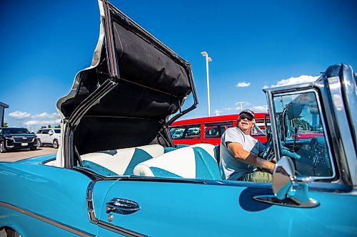 MIKAELA MACKENZIE / WINNIPEG FREE PRESS

Jim Beilby opens up the top on his &#x575;6 Chevrolet Bel Aire convertible at the first annual Show &amp; Shine car show at the Gauthier Cadillac Experience Centre on Thursday, July 27, 2023. Standup.
Winnipeg Free Press 2023