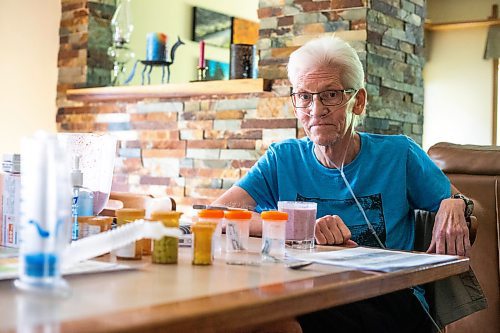 MIKAELA MACKENZIE / WINNIPEG FREE PRESS

Rick Schmidt at his kitchen table (with various medicines, charts, and equipment) while recovering from a lung transplant on Thursday, July 27, 2023. For John Longhurst story.
Winnipeg Free Press 2023