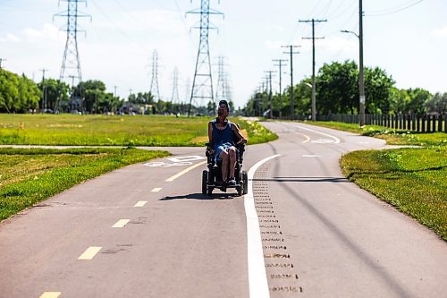 MIKAELA MACKENZIE / WINNIPEG FREE PRESS

Carey Hacault wheels down the new Northwest Hydro Corridor Multi-Use Path on Thursday, July 27, 2023. For &#x460;story.
Winnipeg Free Press 2023