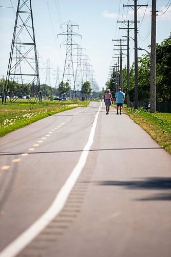 MIKAELA MACKENZIE / WINNIPEG FREE PRESS

Sandra Kolter and Marcel Chartier walk down the new Northwest Hydro Corridor Multi-Use Path on Thursday, July 27, 2023. For &#x460;story.
Winnipeg Free Press 2023