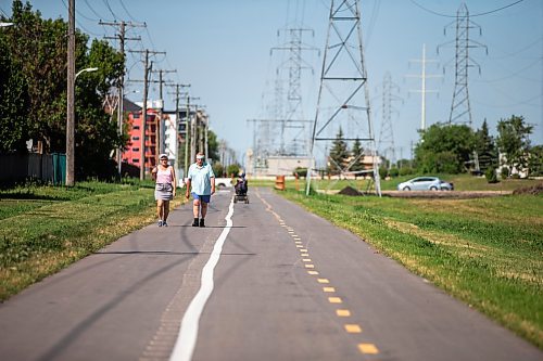 MIKAELA MACKENZIE / WINNIPEG FREE PRESS

Sandra Kolter and Marcel Chartier walk down the new Northwest Hydro Corridor Multi-Use Path on Thursday, July 27, 2023. For &#x460;story.
Winnipeg Free Press 2023