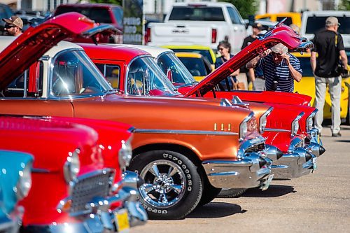 MIKAELA MACKENZIE / WINNIPEG FREE PRESS

Richard Facia takes a look at the cars at the first annual Show &amp; Shine car show at the Gauthier Cadillac Experience Centre on Thursday, July 27, 2023. Standup.
Winnipeg Free Press 2023