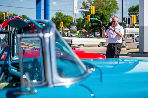 MIKAELA MACKENZIE / WINNIPEG FREE PRESS

Tom Romanow takes photos of the cars at the first annual Show &amp; Shine car show at the Gauthier Cadillac Experience Centre on Thursday, July 27, 2023. Standup.
Winnipeg Free Press 2023