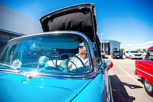 MIKAELA MACKENZIE / WINNIPEG FREE PRESS

Jim Beilby opens up the top on his &#x575;6 Chevrolet Bel Aire convertible at the first annual Show &amp; Shine car show at the Gauthier Cadillac Experience Centre on Thursday, July 27, 2023. Standup.
Winnipeg Free Press 2023