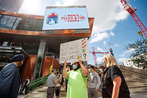 MIKE DEAL / WINNIPEG FREE PRESS
A group of about twenty protesters try to disrupt the announcement that Winnipeg was chosen as the location for the 2023 World Police and Fire Games at True North Square Friday.
see Tyler Searle story
220715 - Friday, July 15, 2022.