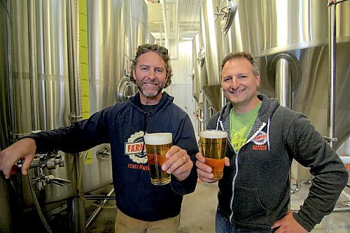 Brothers Lawrence and Chris Warwaruk pose in front of some fermenting tanks at Farmery Estate Brewery in 2019. The brother's company received a $150,000 government grant on Friday for their commitment to reducing carbon emissions. (File)



- for Martin Cash story / Winnipeg Free Press 2019