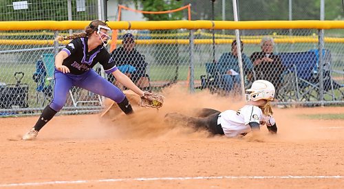 Westman Magic base runner Emily Beckwith (44) slides safely into the bag as Central Energy third baseman Molly Cowan (13) tries to tag her out during Softball Manitoba&#x2019;s under-15 AAA provincial championship at Ashley Neufeld Softball Complex on Friday. (Perry Bergson/The Brandon Sun)
July 28, 2023
