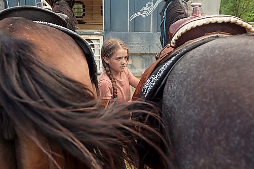 27072023
Lissie Bouer gets horses ready with her sisters before performing in the grand entry and national anthems during the first go-round of the Manitoba Threshermen&#x2019;s Reunion and Stampede rodeo near Austin, Manitoba on Thursday evening.  (Tim Smith/The Brandon Sun)