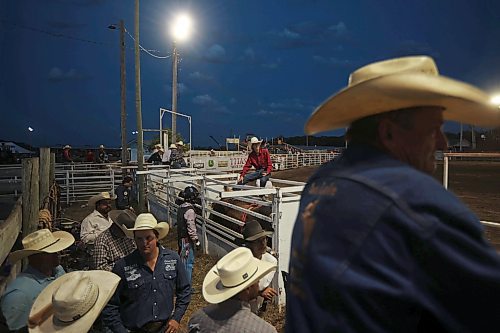 27072023
Cowboys pack the area behind the chutes during the bull riding event at the Manitoba Threshermen&#x2019;s Reunion and Stampede near Austin, Manitoba on Thursday evening.  (Tim Smith/The Brandon Sun)