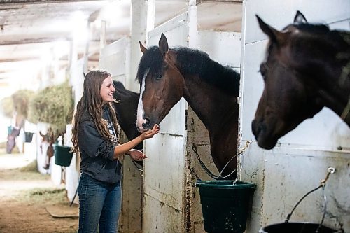 MIKAELA MACKENZIE / WINNIPEG FREE PRESS

Olive Johnston and horse Commandoslastdance, debutante stakes winner, at the Assiniboia Downs barns on Friday, July 28, 2023. For George Williams story.
Winnipeg Free Press 2023