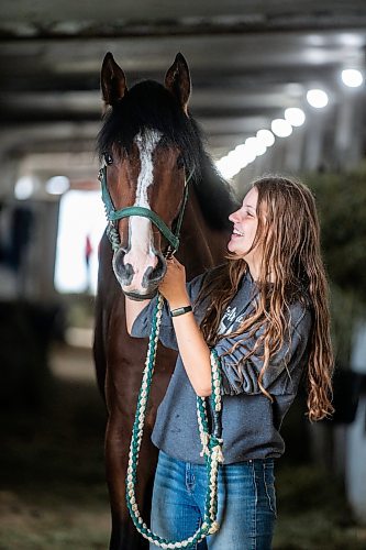 MIKAELA MACKENZIE / WINNIPEG FREE PRESS

Olive Johnston and horse Commandoslastdance, debutante stakes winner, at the Assiniboia Downs barns on Friday, July 28, 2023. For George Williams story.
Winnipeg Free Press 2023