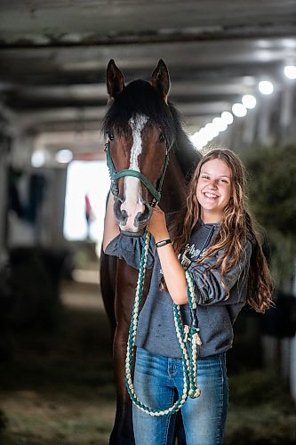 MIKAELA MACKENZIE / WINNIPEG FREE PRESS

Olive Johnston and horse Commandoslastdance, debutante stakes winner, at the Assiniboia Downs barns on Friday, July 28, 2023. For George Williams story.
Winnipeg Free Press 2023