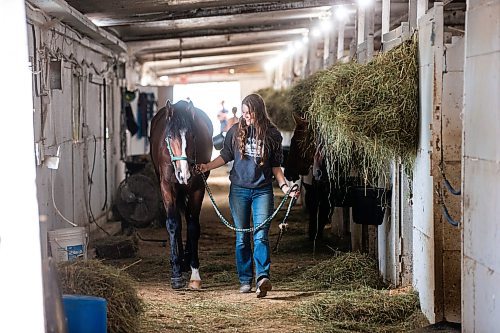 MIKAELA MACKENZIE / WINNIPEG FREE PRESS

Olive Johnston and horse Commandoslastdance, debutante stakes winner, at the Assiniboia Downs barns on Friday, July 28, 2023. For George Williams story.
Winnipeg Free Press 2023