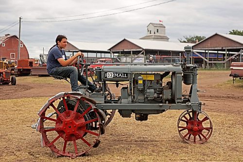 28072023
Dustin Green of Killarney drives an old Farmall Regular  tractor while taking part in the Pioneer power parade at the Manitoba Threshermen&#x2019;s Reunion and Stampede near Austin, Manitoba on Friday afternoon.  (Tim Smith/The Brandon Sun)