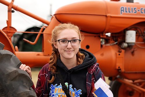 28072023
Alissa Fleury with her dad Bill&#x2019;s 1940 Allis-Chalmers tractor after taking part in the Pioneer power parade at the Manitoba Threshermen&#x2019;s Reunion and Stampede near Austin, Manitoba on Friday afternoon.  (Tim Smith/The Brandon Sun)