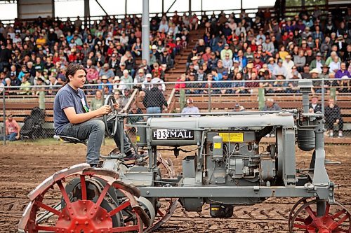 28072023
Dustin Green of Killarney drives an old Farmall Regular  tractor while taking part in the Pioneer power parade at the Manitoba Threshermen&#x2019;s Reunion and Stampede near Austin, Manitoba on Friday afternoon.  (Tim Smith/The Brandon Sun)