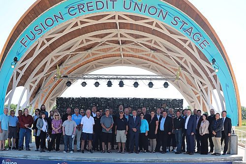 Members of the provincial and municipal government pose for a group photo at the Fusion Credit Union Stage on Monday alongside some of the Westman recipients of the Arts, Culture and Sport in Community Fund. (Kyle Darbyson/The Brandon Sun)