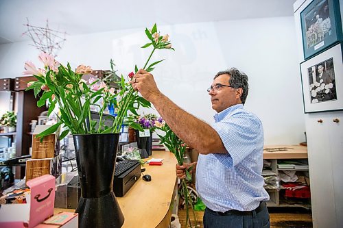 MIKAELA MACKENZIE / WINNIPEG FREE PRESS

Ernest Cholakis, co-owner of Broadway Florists, puts together a bouquet at the flower shop on Academy on Monday, July 31, 2023. They are celebrating 100 years open this September. For Gabby Piche story.
Winnipeg Free Press 2023