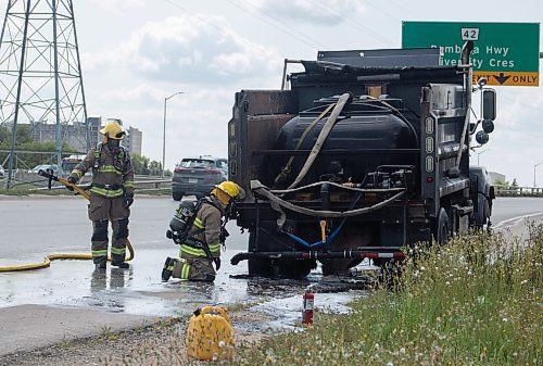 Mike Thiessen / Winnipeg Free Press 
Winnipeg Fire Department crews were called to a burning truck at Abinojii Mikanah and River Road around 3:00 pm today. 230731 &#x2013; Monday, July 31, 2023