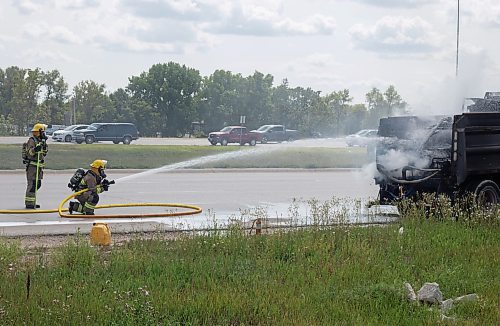 Mike Thiessen / Winnipeg Free Press 
Winnipeg Fire Department crews were called to a burning truck at Abinojii Mikanah and River Road around 3:00 pm today. 230731 &#x2013; Monday, July 31, 2023