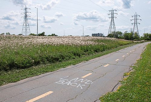 Mike Thiessen / Winnipeg Free Press 
Anti-police slogans were spray painted on the River Road bike path, part of the World Police and Fire Games mini-marathon track. For Erik Pindera. 230731 &#x2013; Monday, July 31, 2023