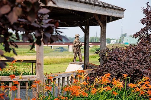 MIKE DEAL / WINNIPEG FREE PRESS
A statue dedicated to the Arborg-Bifrost Fire and Emergency Services sits in a park along the Icelandic River in Arborg, MB.
230731 - Monday, July 31, 2023.