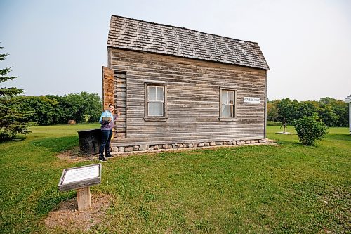 MIKE DEAL / WINNIPEG FREE PRESS
Emma Sigvaldason conducts a tour, stopping at the Vigfusson House in the Arborg &amp; District Multicultural Heritage Village in Arborg, MB.
230731 - Monday, July 31, 2023.