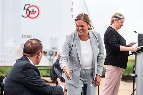 MIKAELA MACKENZIE / WINNIPEG FREE PRESS

Premier Heather Stefanson shakes hands with CEO of Fastfrate Group Manny Calandrino at the first tenant announcement at the CentrePort Canada Rail Park on Tuesday, Aug. 1, 2023. For Gabby Piche story.
Winnipeg Free Press 2023