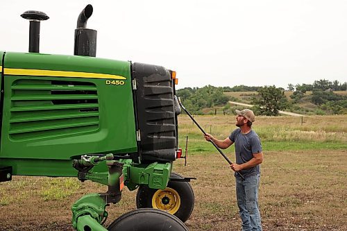 01082023
Rob Baker washes a John Deere swather that he plans on selling at his farm west of Brandon on Tuesday. Baker has wheat, canola and soy beans in the ground this year and expects to begin harvest in approximately three weeks. (Tim Smith/The Brandon Sun)
