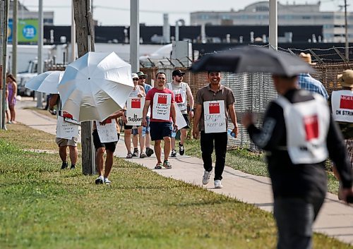 JOHN WOODS / WINNIPEG FREE PRESS
MLL workers walk the picket line outside the distribution centre on King Edward in Winnipeg, Tuesday, August 1, 2023. It is alleged that the province has hired replacement workers at the distribution centre.

Reporter: