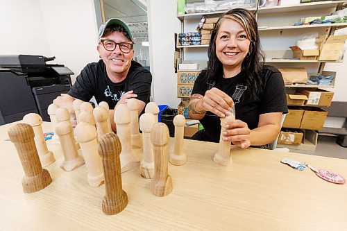 MIKE DEAL / WINNIPEG FREE PRESS
Gillian Roy (right), executive director, at Sexual Education Resource Centre, with Jason Hooper (left) who has volunteered his time and his lathe to make 20 Woodies &#x2014; wooden phalluses on which to demonstrate condom usage &#x2014;  for SERC after they put a call out following a shortage.
See Jen Zoratti story
230802 - Wednesday, August 02, 2023.