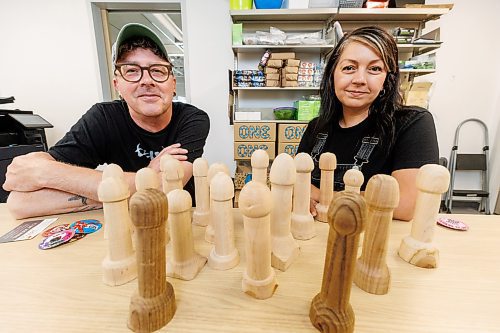 MIKE DEAL / WINNIPEG FREE PRESS
Gillian Roy (right), executive director, at Sexual Education Resource Centre, with Jason Hooper (left) who has volunteered his time and his lathe to make 20 Woodies &#x2014; wooden phalluses on which to demonstrate condom usage &#x2014;  for SERC after they put a call out following a shortage.
See Jen Zoratti story
230802 - Wednesday, August 02, 2023.