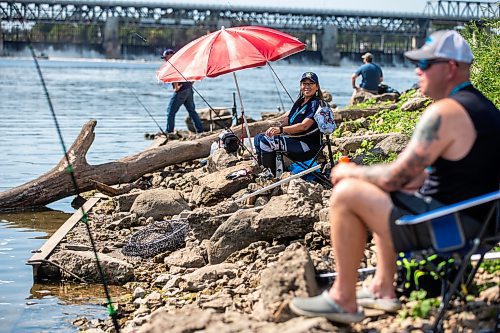 MIKAELA MACKENZIE / WINNIPEG FREE PRESS

Tara Singleton competes in angling for catfish in the World Police and Fire Games at Lockport on Wednesday, Aug. 2, 2023. For &#x2014; story.
Winnipeg Free Press 2023