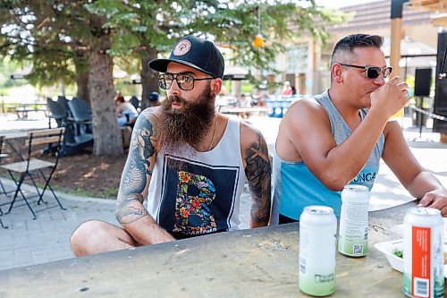 MIKE DEAL / WINNIPEG FREE PRESS
Casey Forzley (left) at the Cargo Bar with some friends chats about the idea that Winnipeg should follow Toronto&#x2019;s pilot project that allows drinking in some of their public parks.
Drinking in public parks is on Regina's council agenda this month, after the Saskatchewan government amended its liquor act.
See Chris Kitching story
230802 - Wednesday, August 02, 2023.