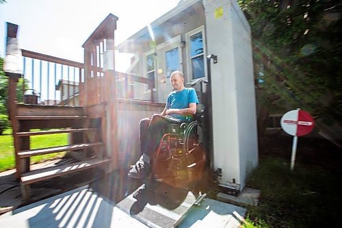 MIKAELA MACKENZIE / WINNIPEG FREE PRESS

Mitch Krohn, a Transit Plus rider, wheels to the pad in front of his house where he waits (often for hours) on Wednesday, Aug. 2, 2023. For Joyanne story.
Winnipeg Free Press 2023