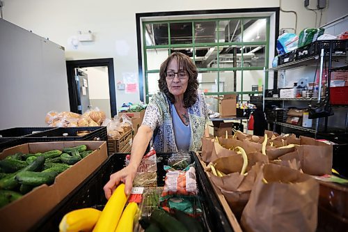 02082023
Lorraine Lagace, a volunteer at Samaritan House Ministries, organizes the weekly shopping station at the local food bank on Wednesday. (Tim Smith/The Brandon Sun)