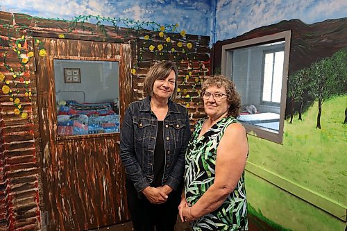 02082023
Heather Bolech, manager of the Samaritan House Ministries Safe and Warm Shelter, and Barbara McNish, executive director of SHM, in front of a new mural outside one of the rooms in the Safe and Warm Shelter on Wednesday. (Tim Smith/The Brandon Sun)