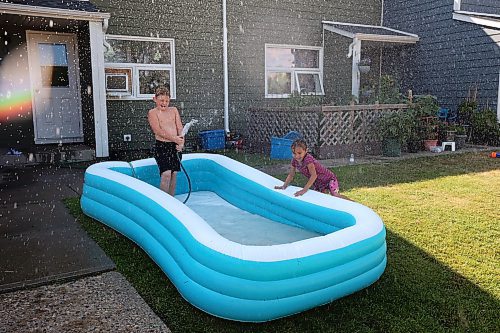 02082023
Kids keep cool while playing in an inflatable pool in Brandon&#x2019;s east end on a scorching hot Wednesday.  (Tim Smith/The Brandon Sun)