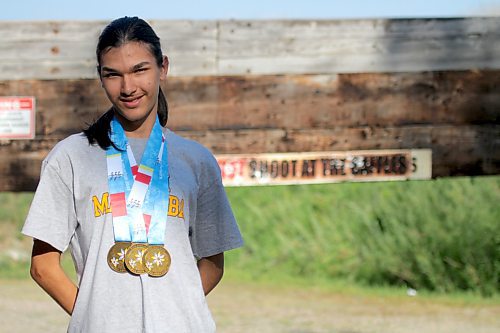 Zerick Dysart-Waterman poses with his three North American Indigenous Games gold medals at the Brandon Wildlife Association shooting range before a junior rifle club practice on Wednesday. (Thomas Friesen/The Brandon Sun)