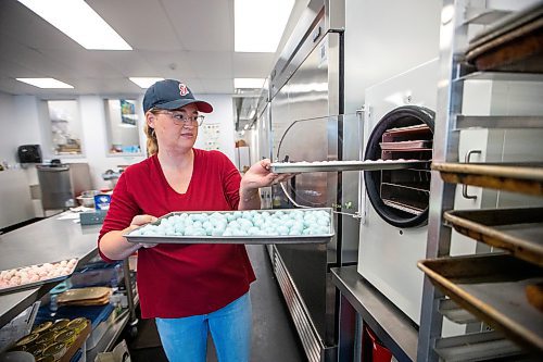 MIKAELA MACKENZIE / WINNIPEG FREE PRESS

Sydney Gervais, owner of the Polar Shoppe, takes out saltwater taffy out of the freeze-dryer at the commercial kitchen where they freeze-dry the candy on Wednesday, Aug. 2, 2023. For Dave Sanderson story.
Winnipeg Free Press 2023