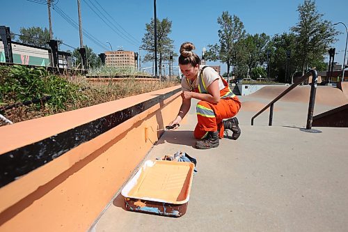 03082023
Lauren Michta with the City of Brandon Parks and Recreation Services department works to repaint the Kristopher Campbell Memorial Skatepark with other workers on a hot Thursday morning.
(Tim Smith/The Brandon Sun)