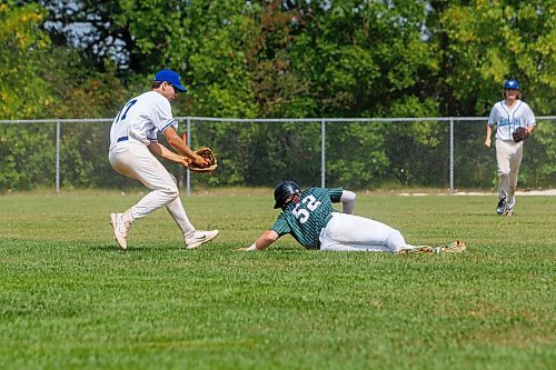 MIKE DEAL / WINNIPEG FREE PRESS
Host Manitoba&#x2019;s Riley Hruska (17) runs down P.E.I.&#x2019;s Duncan Picketts (52) between Third and Second base, during the U22 men's baseball national championships game, at Fines Field in Stonewall Quarry Park in Stonewall, MB, Thursday afternoon.
230803 - Thursday, August 03, 2023.