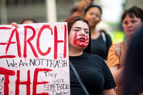 MIKAELA MACKENZIE / WINNIPEG FREE PRESS

Tristina Houle at a round dance calling for the landfills to be searched at Portage and Main on Thursday, Aug. 3, 2023. For Tessa story.
Winnipeg Free Press 2023