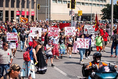 MIKAELA MACKENZIE / WINNIPEG FREE PRESS

Protestors calling for the landfills to be searched march from Portage and Main to the Legislature on Thursday, Aug. 3, 2023. For Tessa story.
Winnipeg Free Press 2023