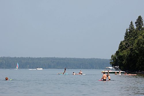 03082023
Swimmers and paddle boarders enjoy the cool water of Clear Lake in Riding Mountain National Park on a hot Thursday. 
(Tim Smith/The Brandon Sun)